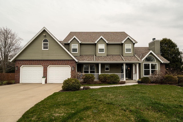 4824 Hampton Ct, Mount Pleasant, WI 53403 - traditional-style house with a porch, a front lawn, brick siding, and concrete driveway