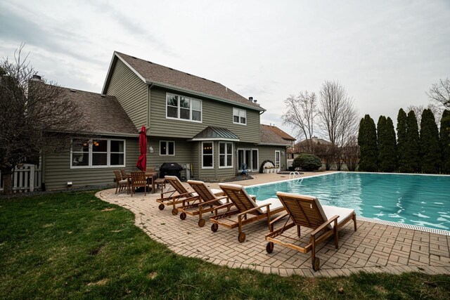 4824 Hampton Ct, Mount Pleasant, WI 53403 - view of pool with fence, a lawn, a fenced in pool, and a patio