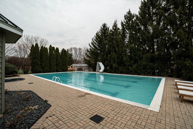 4824 Hampton Ct, Mount Pleasant, WI 53403 - pool featuring a water slide and a patio