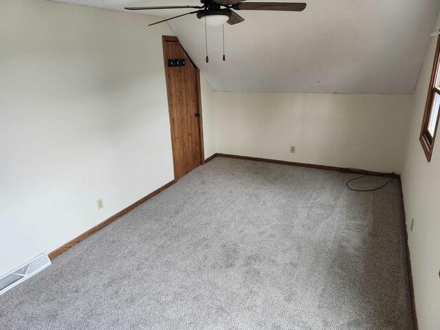 N9148 Sandy Lake Rd, Neshkoro, WI 54960 - bonus room featuring carpet flooring, visible vents, baseboards, ceiling fan, and lofted ceiling