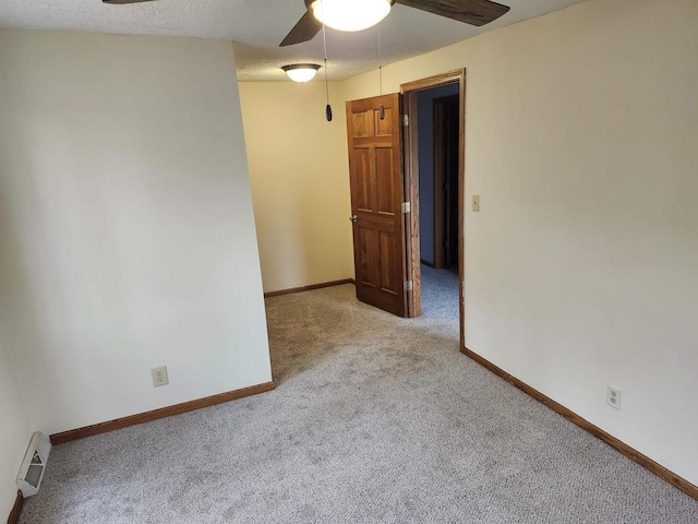 N9148 Sandy Lake Rd, Neshkoro, WI 54960 - spare room featuring a textured ceiling, visible vents, carpet, baseboards, and ceiling fan