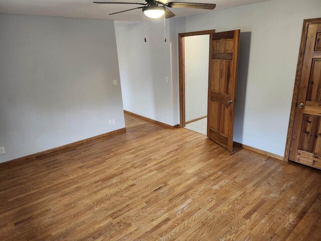 N9148 Sandy Lake Rd, Neshkoro, WI 54960 - unfurnished room featuring baseboards, light wood-style floors, and a ceiling fan