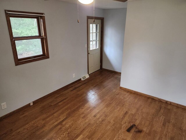 N9148 Sandy Lake Rd, Neshkoro, WI 54960 - spare room with baseboards, visible vents, ceiling fan, and wood finished floors