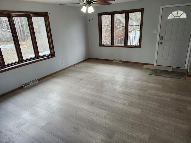 N9148 Sandy Lake Rd, Neshkoro, WI 54960 - entrance foyer with baseboards, visible vents, light wood-style floors, and a ceiling fan