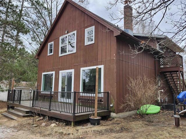 N9148 Sandy Lake Rd, Neshkoro, WI 54960 - rear view of property featuring a wooden deck and a chimney