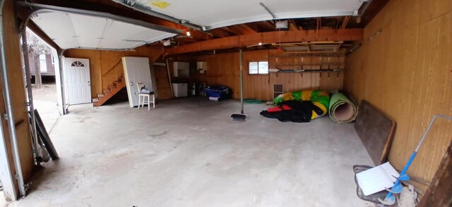 N9148 Sandy Lake Rd, Neshkoro, WI 54960 - garage featuring a garage door opener and wooden walls