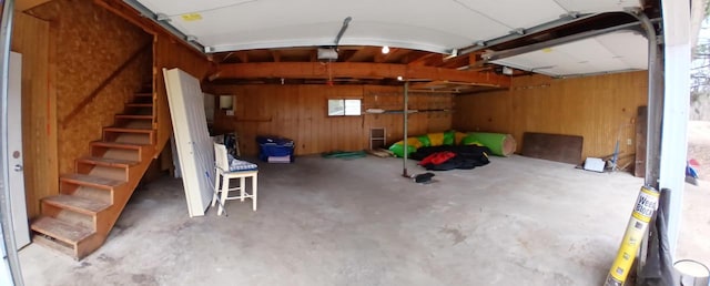 N9148 Sandy Lake Rd, Neshkoro, WI 54960 - garage featuring wood walls and a garage door opener