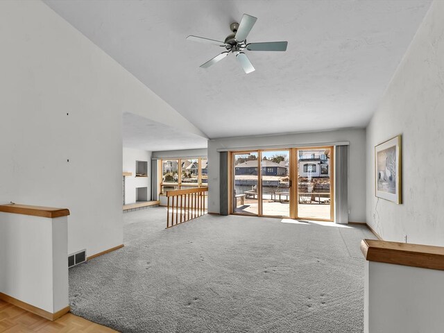 535 E Vine Ct, Sturgeon Bay, WI 54235 - unfurnished living room with baseboards, visible vents, carpet flooring, and a ceiling fan