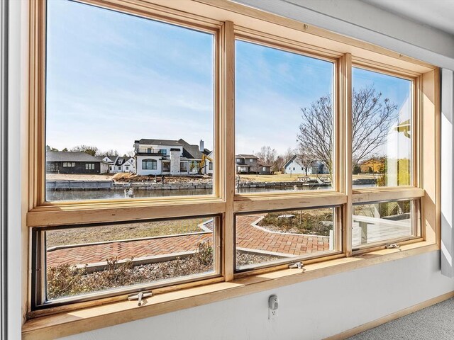535 E Vine Ct, Sturgeon Bay, WI 54235 - room details featuring a residential view, a water view, and baseboards