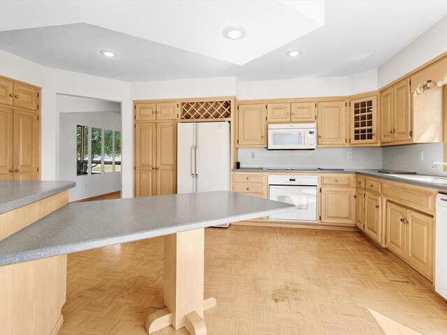 535 E Vine Ct, Sturgeon Bay, WI 54235 - kitchen with a kitchen breakfast bar, recessed lighting, white appliances, light brown cabinetry, and a sink