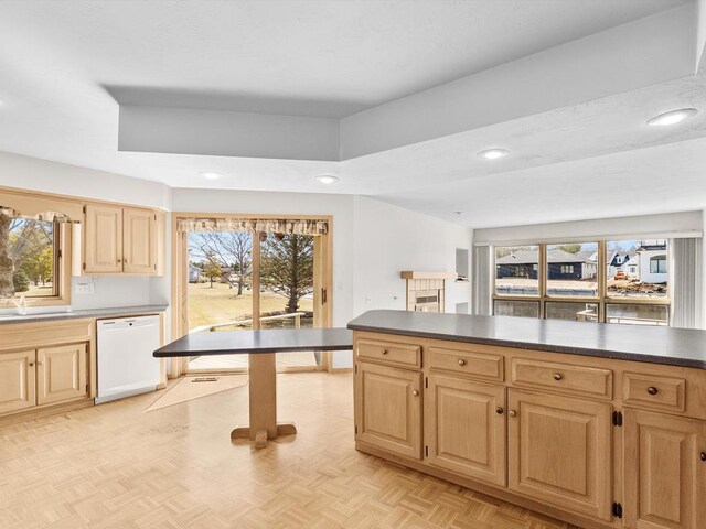 535 E Vine Ct, Sturgeon Bay, WI 54235 - kitchen featuring dark countertops, white dishwasher, light brown cabinetry, and recessed lighting