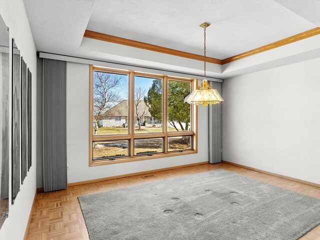 535 E Vine Ct, Sturgeon Bay, WI 54235 - empty room featuring baseboards and a tray ceiling