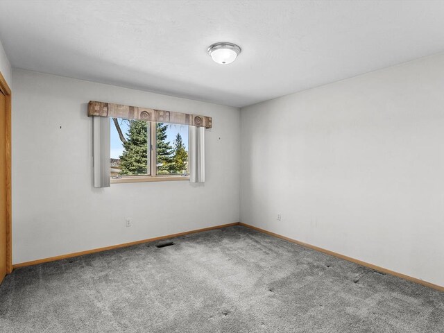 535 E Vine Ct, Sturgeon Bay, WI 54235 - carpeted spare room with baseboards and visible vents