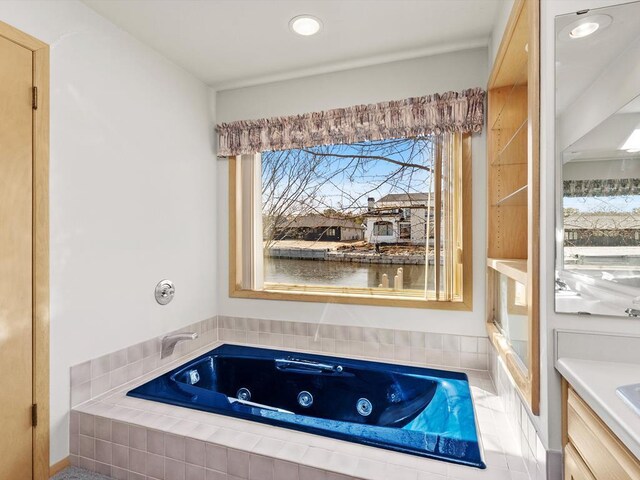 535 E Vine Ct, Sturgeon Bay, WI 54235 - bathroom featuring a tub with jets and vanity