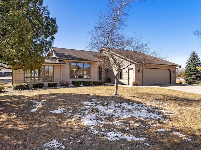535 E Vine Ct, Sturgeon Bay, WI 54235 - mid-century inspired home featuring a garage, concrete driveway, and roof with shingles