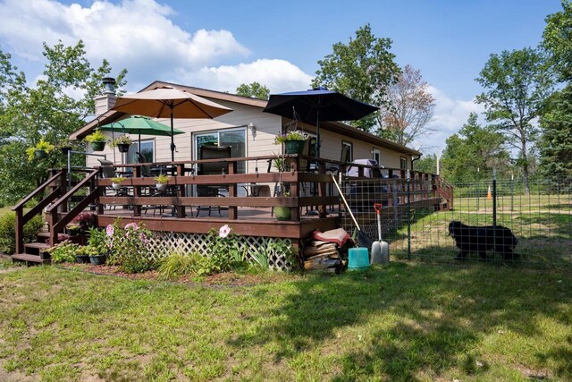 N9656 19th Ave, Necedah, WI 54646 - view of play area with fence, a lawn, and a wooden deck