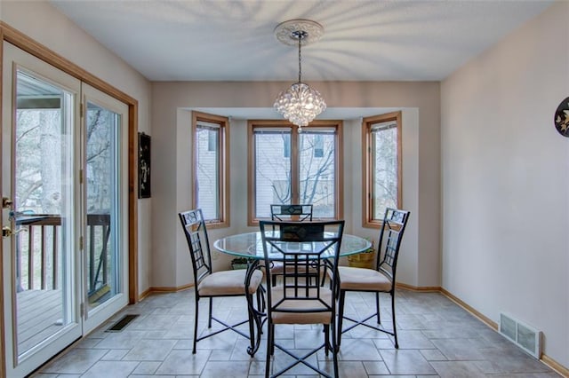 4330 S Pointe Ct, Eau Claire, WI 54701 - dining area featuring a notable chandelier, visible vents, and plenty of natural light