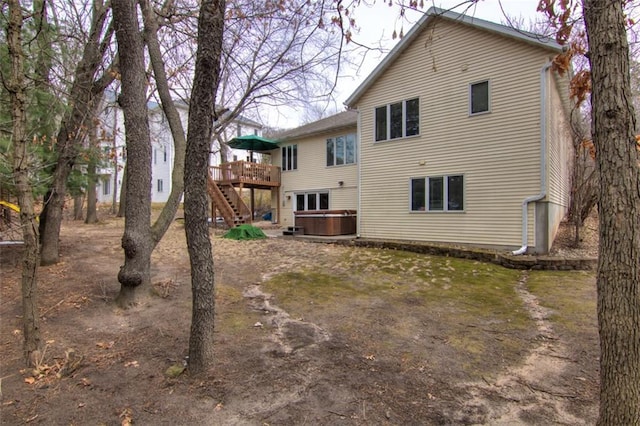 4330 S Pointe Ct, Eau Claire, WI 54701 - back of property with a deck, stairs, and a hot tub