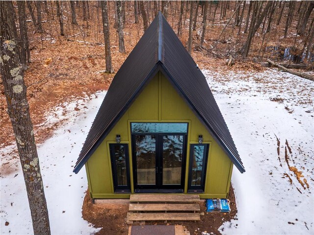 61128 Fleming Loop, Askov, MN 55704 - snow covered property entrance with french doors