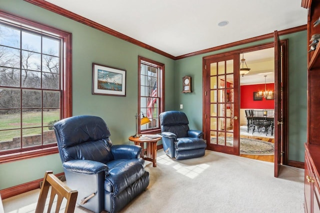 S51W29202 Ridgefield Rd, Waukesha, WI 53189 - living area with baseboards, a chandelier, french doors, crown molding, and carpet floors