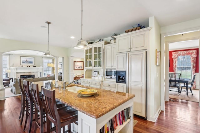 S51W29202 Ridgefield Rd, Waukesha, WI 53189 - kitchen with decorative columns, plenty of natural light, dark wood-type flooring, and a sink