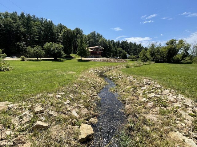 26350 Drake Ln, Cazenovia, WI 53924 - view of yard featuring a forest view