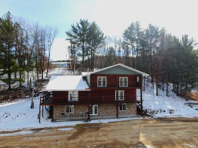 26350 Drake Ln, Cazenovia, WI 53924 - snow covered house with french doors