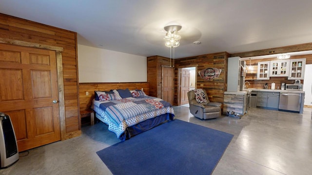 26350 Drake Ln, Cazenovia, WI 53924 - bedroom featuring a sink, wooden walls, and concrete flooring
