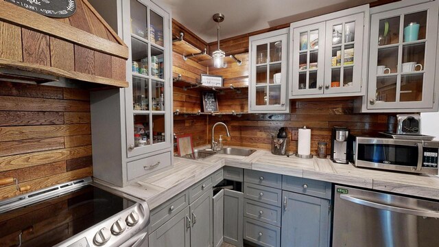 26350 Drake Ln, Cazenovia, WI 53924 - kitchen featuring light countertops, decorative light fixtures, gray cabinets, stainless steel appliances, and a sink
