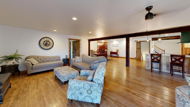 26350 Drake Ln, Cazenovia, WI 53924 - living room with recessed lighting, stairway, a chandelier, and wood finished floors