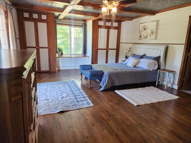 26350 Drake Ln, Cazenovia, WI 53924 - bedroom with wood finished floors, coffered ceiling, and beam ceiling