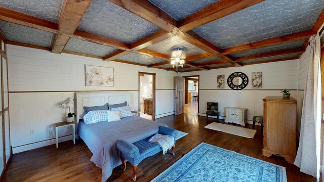 26350 Drake Ln, Cazenovia, WI 53924 - bedroom with coffered ceiling, baseboard heating, wood finished floors, and beam ceiling