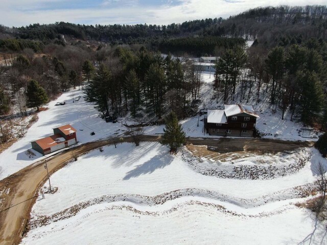 26350 Drake Ln, Cazenovia, WI 53924 - snowy aerial view featuring a wooded view