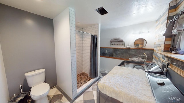 26350 Drake Ln, Cazenovia, WI 53924 - full bathroom featuring toilet and a stall shower