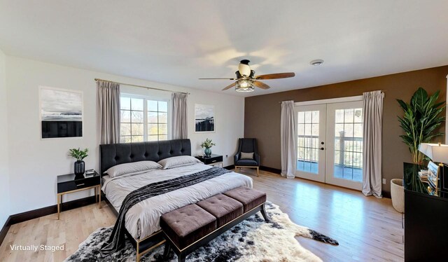 26350 Drake Ln, Cazenovia, WI 53924 - bedroom with multiple windows, access to exterior, light wood finished floors, and french doors
