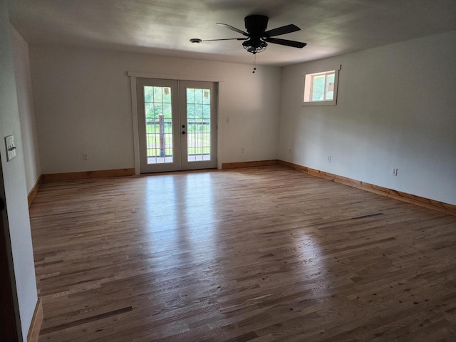 26350 Drake Ln, Cazenovia, WI 53924 - empty room featuring baseboards, wood finished floors, french doors, and a ceiling fan