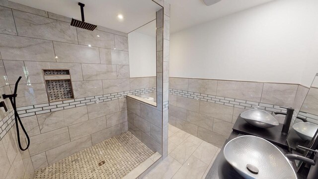 26350 Drake Ln, Cazenovia, WI 53924 - bathroom with dual sinks, tile walls, and walk in shower