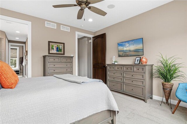 438 Highland Vw, Houlton, WI 54082 - bedroom featuring a ceiling fan, visible vents, light carpet, and baseboards