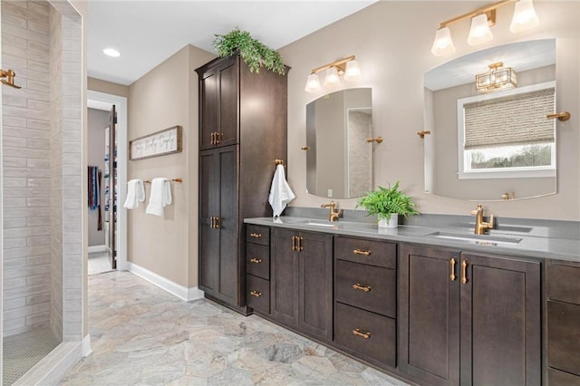 438 Highland Vw, Houlton, WI 54082 - full bath featuring double vanity, tiled shower, marble finish floor, and a sink