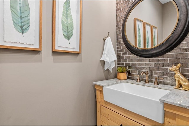 438 Highland Vw, Houlton, WI 54082 - bathroom featuring vanity and tasteful backsplash