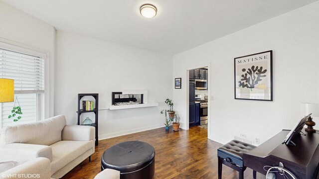 425 Maple Ln, Williams Bay, WI 53191 - living area featuring dark wood finished floors and baseboards