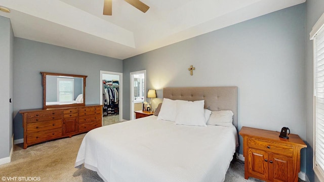 425 Maple Ln, Williams Bay, WI 53191 - bedroom featuring a walk in closet, baseboards, carpet floors, a ceiling fan, and a closet
