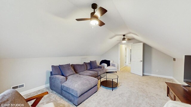 425 Maple Ln, Williams Bay, WI 53191 - living room with lofted ceiling, light colored carpet, baseboards, ceiling fan, and visible vents
