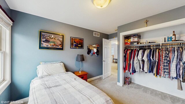 425 Maple Ln, Williams Bay, WI 53191 - carpeted bedroom with baseboards, a closet, and visible vents