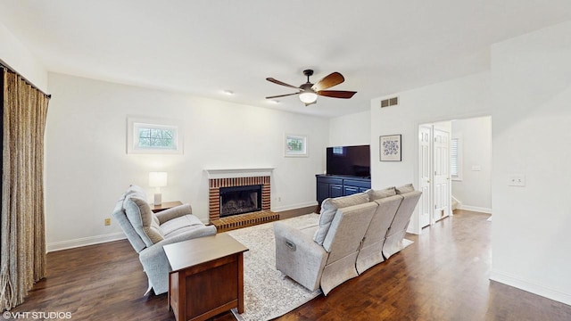 425 Maple Ln, Williams Bay, WI 53191 - living area featuring a brick fireplace, plenty of natural light, dark wood-style floors, and ceiling fan