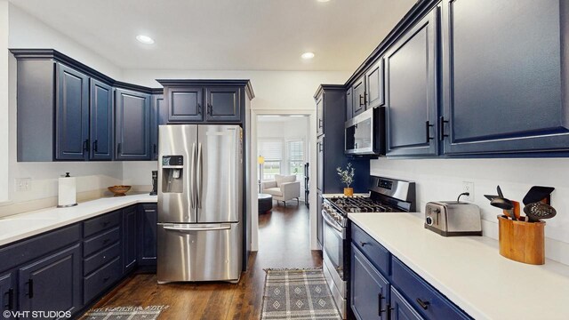 425 Maple Ln, Williams Bay, WI 53191 - kitchen featuring dark wood-style flooring, light countertops, recessed lighting, and appliances with stainless steel finishes
