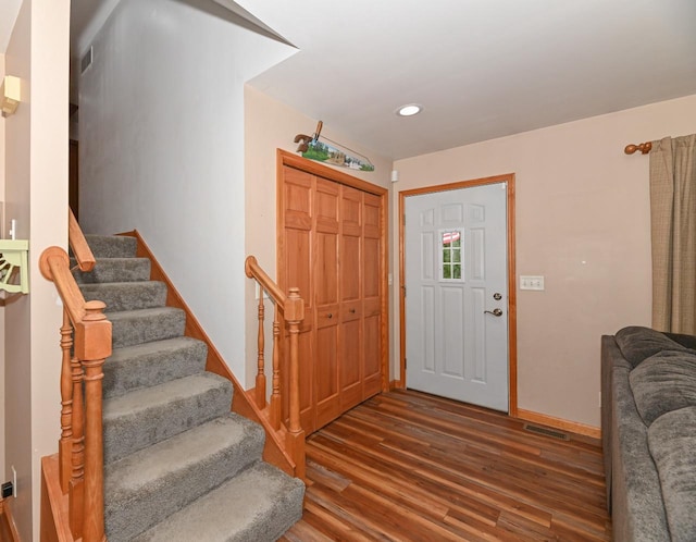 2855 N Shore Dr, Delavan, WI 53115 - foyer featuring baseboards, stairs, visible vents, and wood finished floors