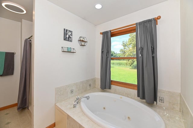 2855 N Shore Dr, Delavan, WI 53115 - bathroom featuring a tub with jets, tile patterned floors, a shower with curtain, and baseboards