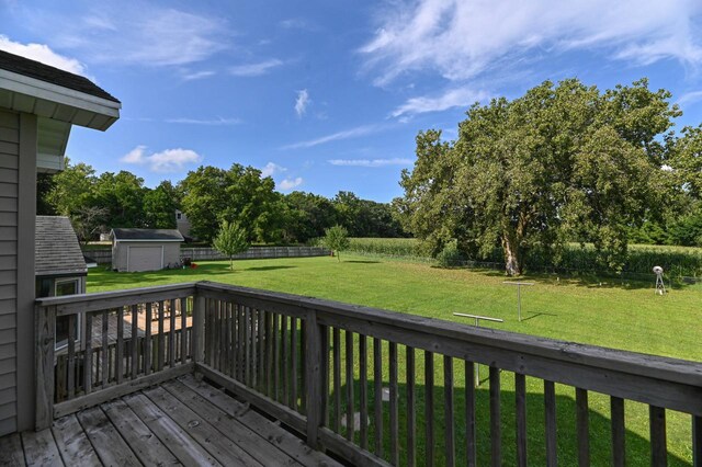 2855 N Shore Dr, Delavan, WI 53115 - wooden terrace featuring a fenced backyard, an outbuilding, a yard, and a storage shed