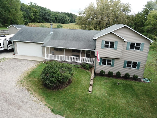 2855 N Shore Dr, Delavan, WI 53115 - tri-level home with an attached garage, a front yard, roof with shingles, driveway, and covered porch